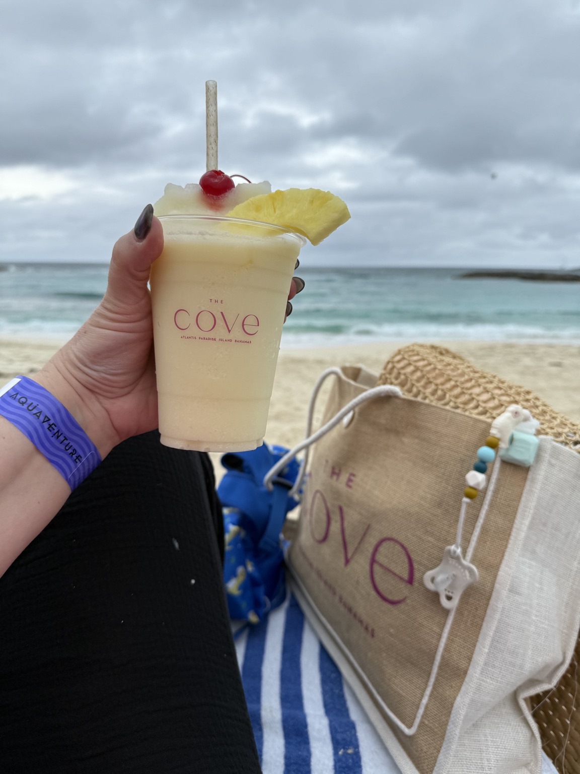 A frozen tropical drink in a Cove cup beside the beach at Atlantis
