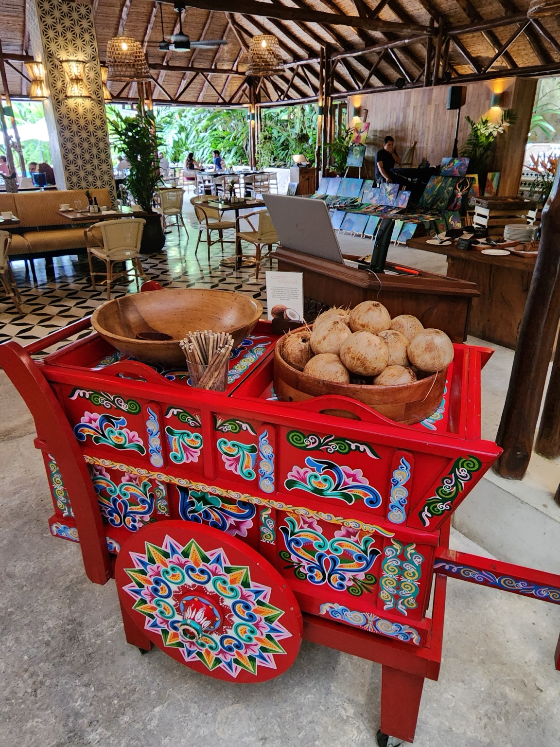 Fresh breads presented on a colorful cart at Nayara breakfast