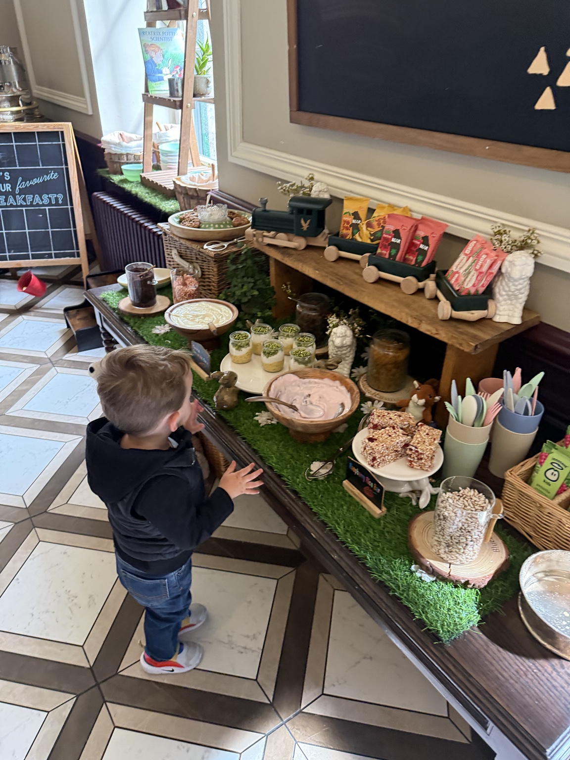 A child exploring the dedicated children's breakfast buffet at Gleneagles