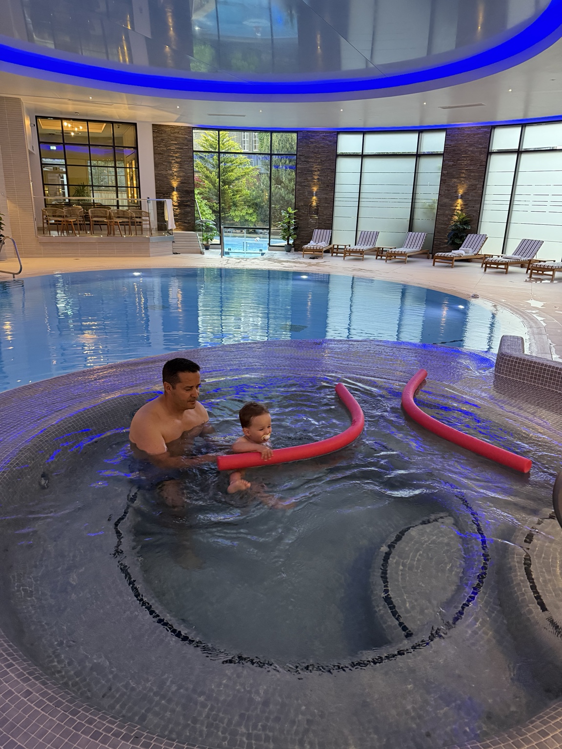 Hassan and his toddler enjoying the family pool at Gleneagles
