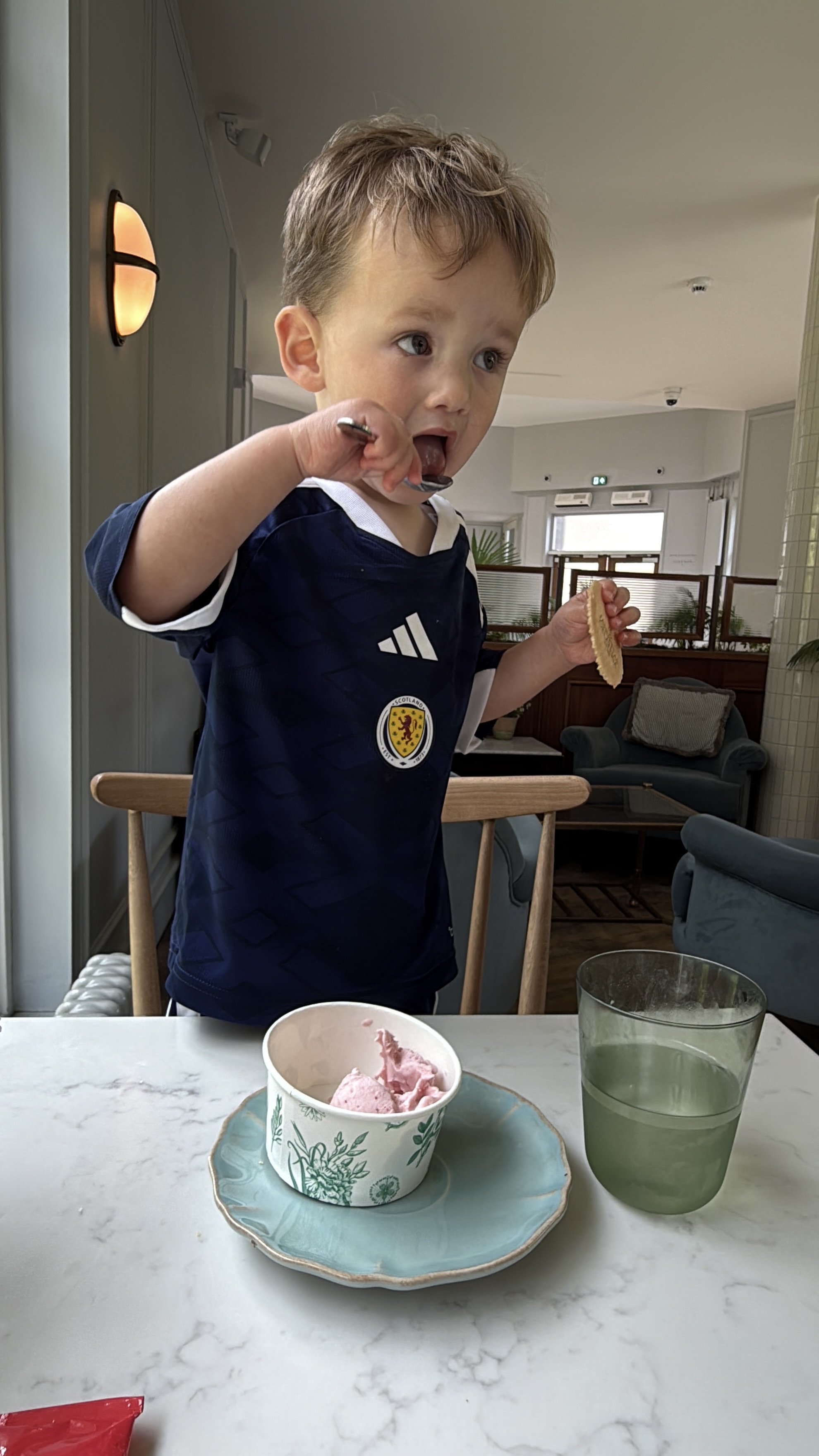 A toddler enjoying ice cream in the Garden Café at Gleneagles