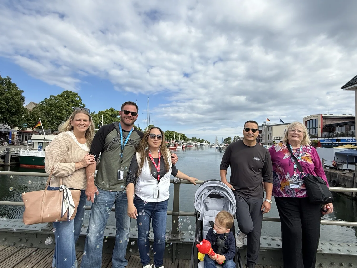 Family together beside the boats in Warnemünde harbor