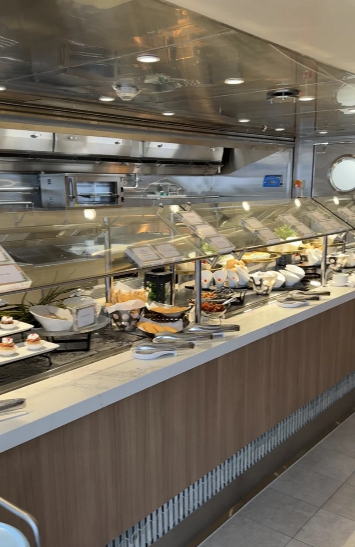 The Grove’s buffet with breads, dips and small dishes behind a glass counter
