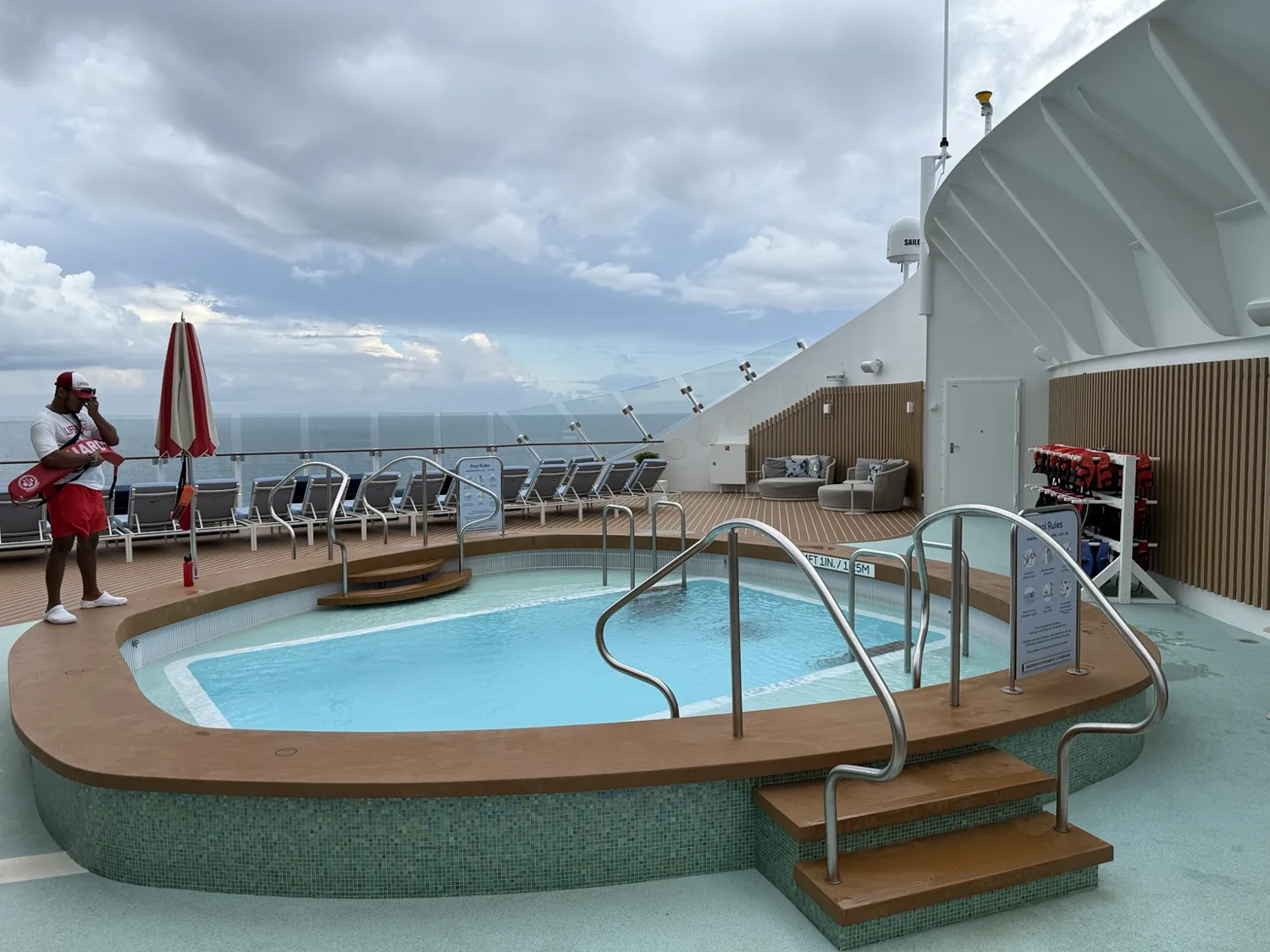 The Grove’s pool on Star of the Seas, surrounded by loungers with an ocean view