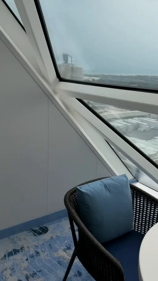 A look at the bed and lounge area in our Panoramic Suite on Star of the Seas